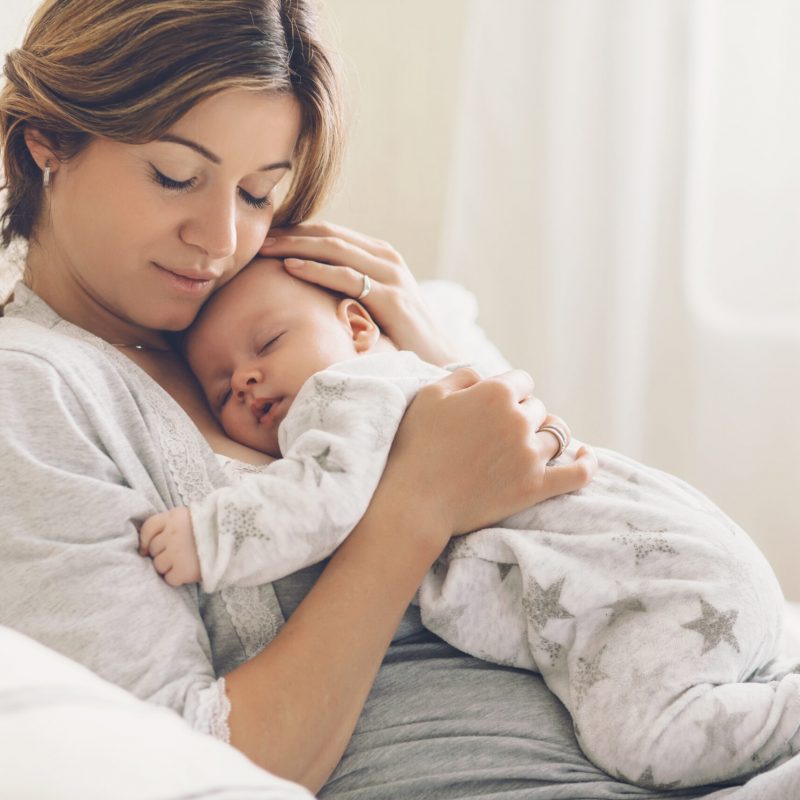 Loving,Mom,Carying,Of,Her,Newborn,Baby,At,Home.,Bright