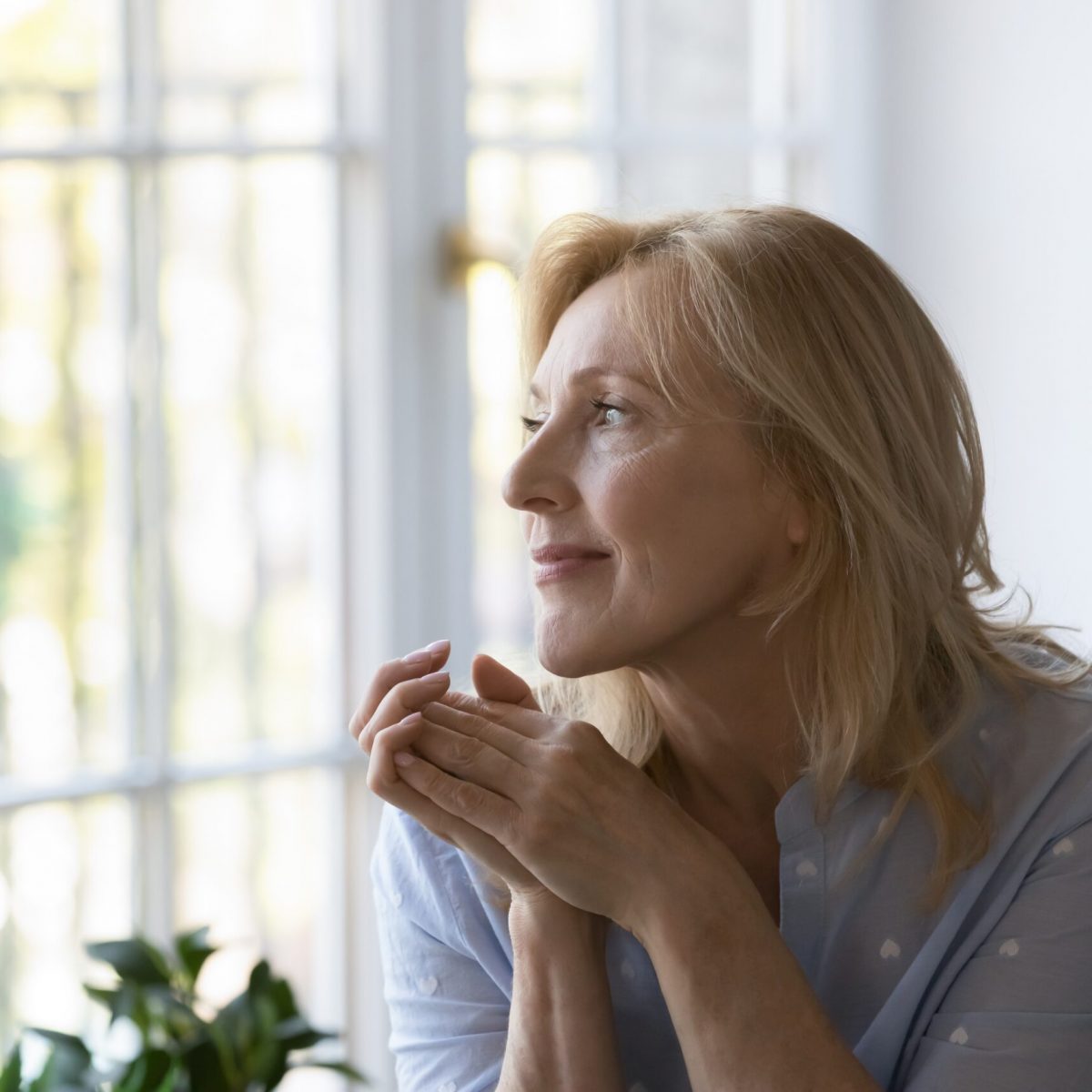 Positive,Thoughtful,Pretty,Middle,Aged,Blond,Woman,Sitting,On,Home Positive,Thoughtful,Pretty,Middle,Aged,Blond,Woman,Sitting,On,Home